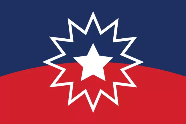 Juneteenth flag, a solid white five pointed star inside a twelve pointed outline star over a curved field of blue and red